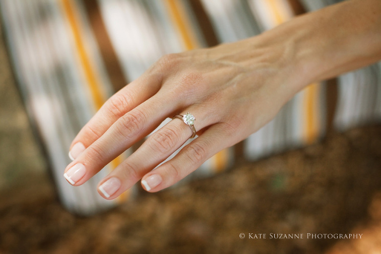 showing off her diamond engagement ring from Brian Gavins Jewelers