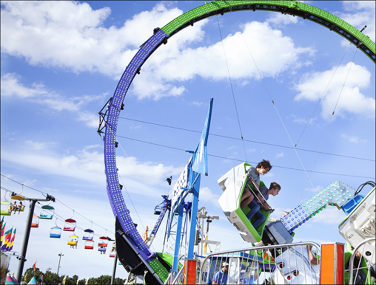 boys-riding-ride-at-fair-border